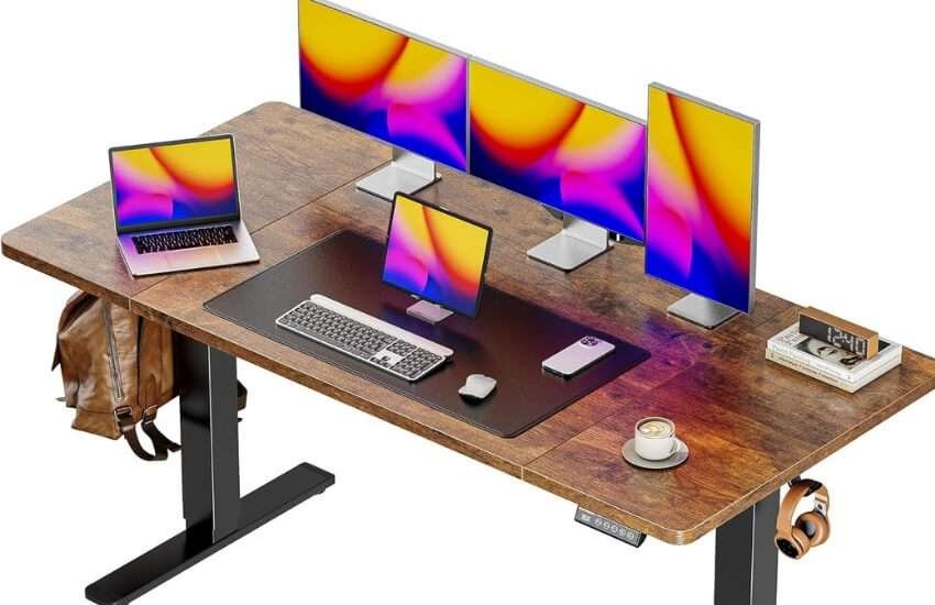 Huuger 55 x 28 inch large electric standing desk with adjustable height and memory controller.